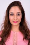 Studio Shot Of Indian Woman Against White Background